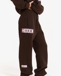 Hidden Hills Gated Community Straight Leg Sweatpants Dark Brown/Light Pink, waist down side view with HIDDEN print and leg label