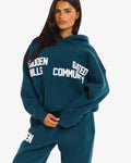 Hidden Hills Gated Community Hoodie Deep Teal, front view with hands clasped
