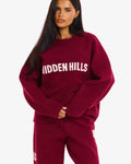 Hidden Hills Knit Sweater Burgundy, front view with hands clasped